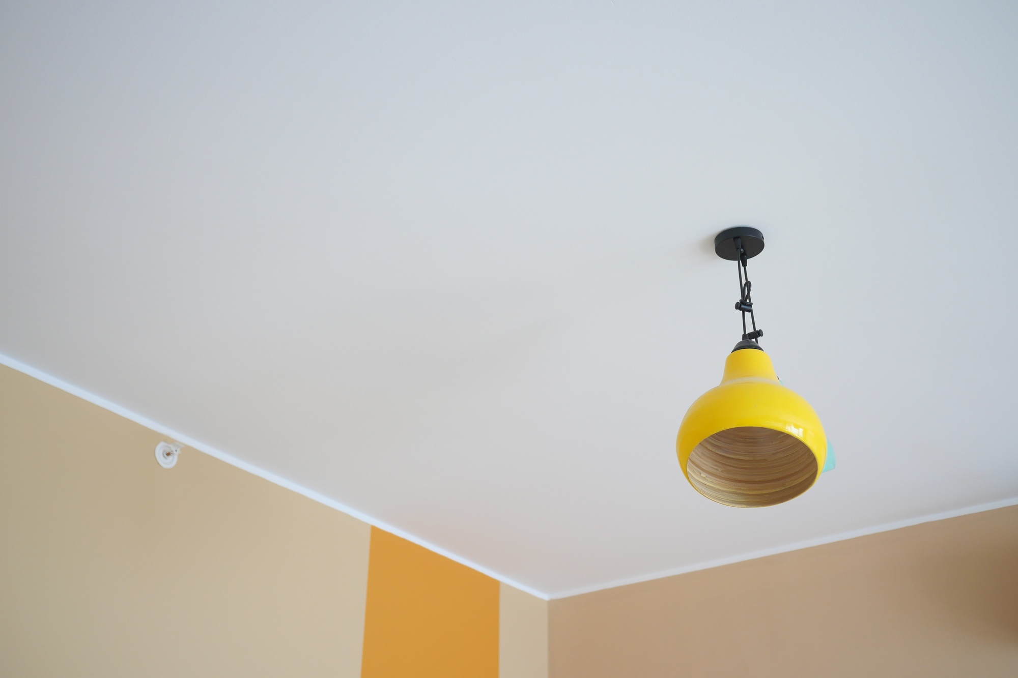 gray ceiling lamp hanging in a room ,